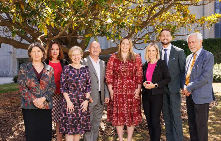 Eight people standing together