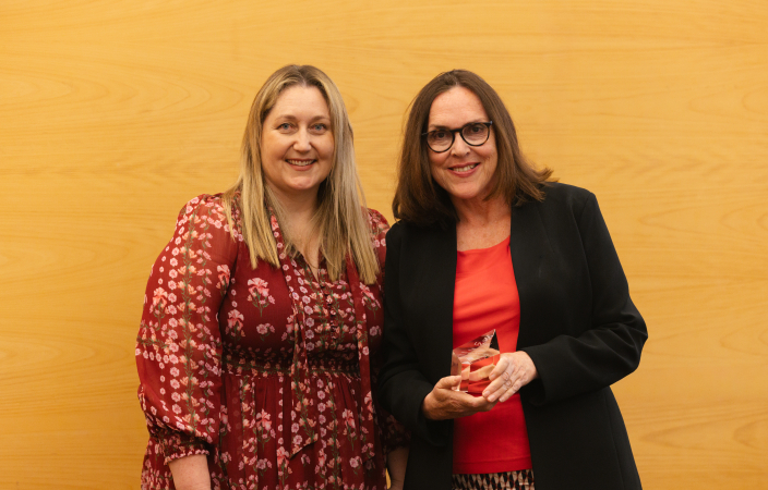 Two women standing together