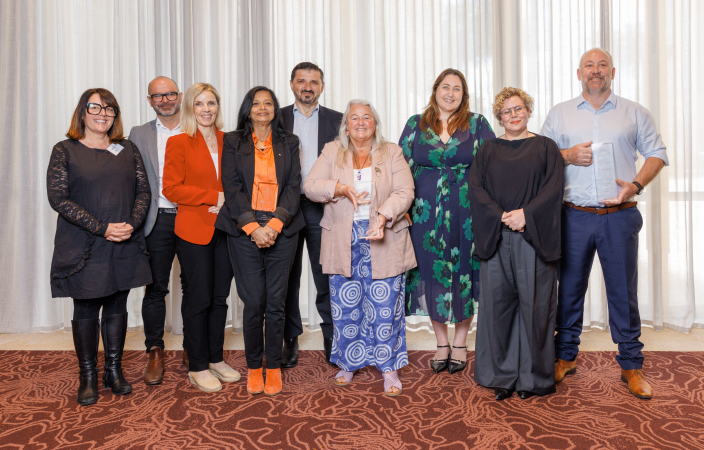 2026 Winners stand with previous award winners